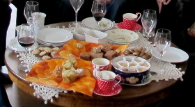 Coffee table with crockery, wine and food to illustrate that objects can be very different from each other.